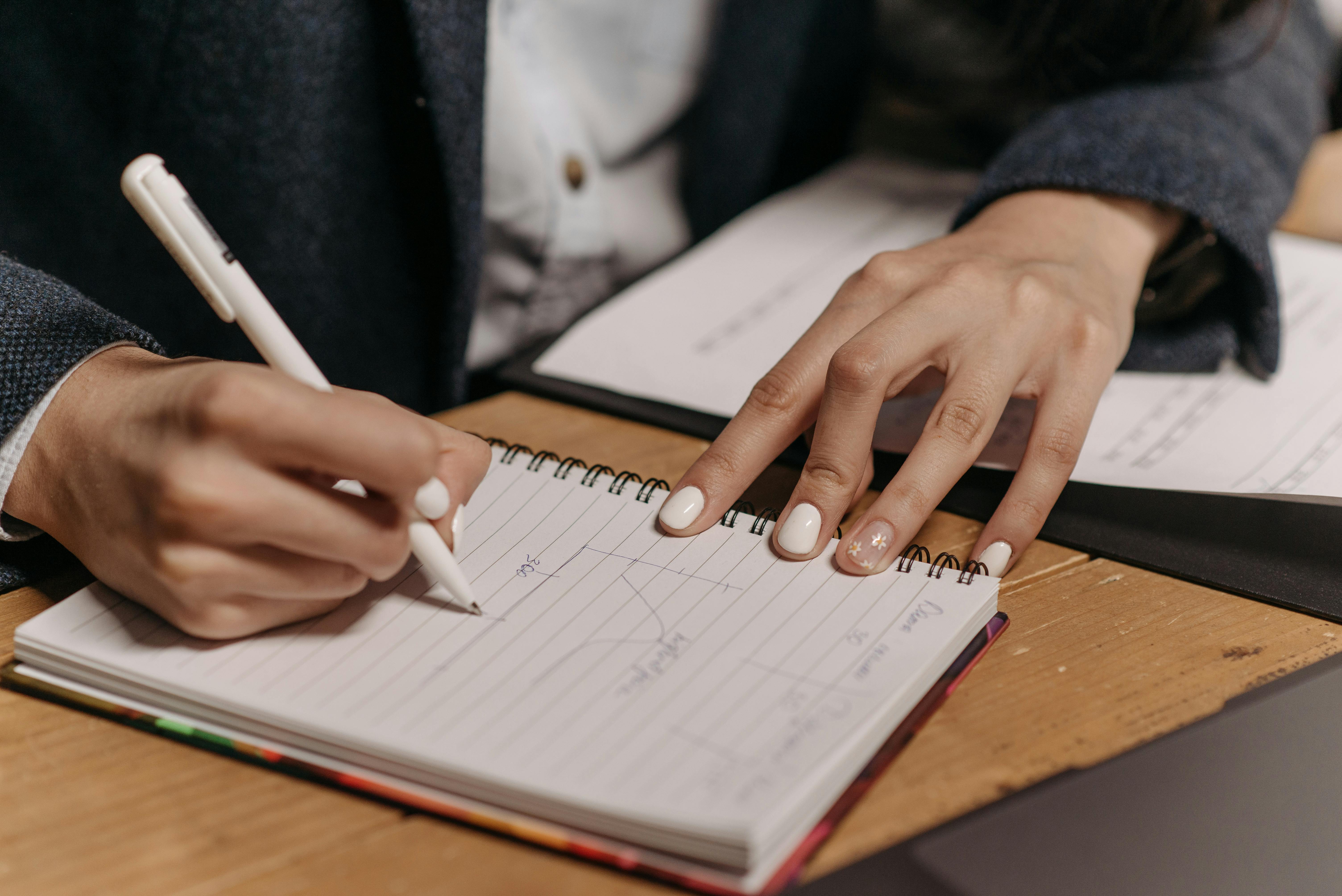 Meetings — writing in notebook